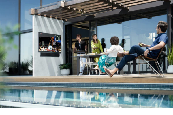 Outdoor living space with integrated audio and lighting